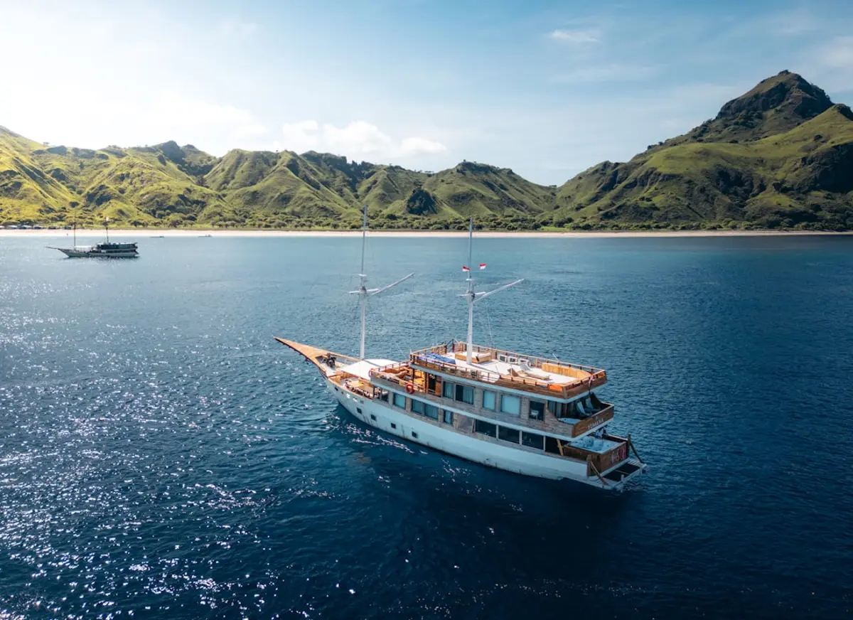 A large boat floating on top of a large body of water